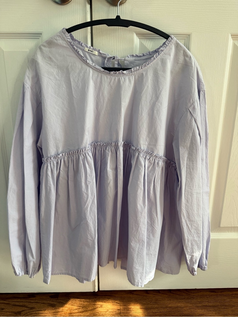 Lavender long sleeve blouse with ruffled hem and tie back